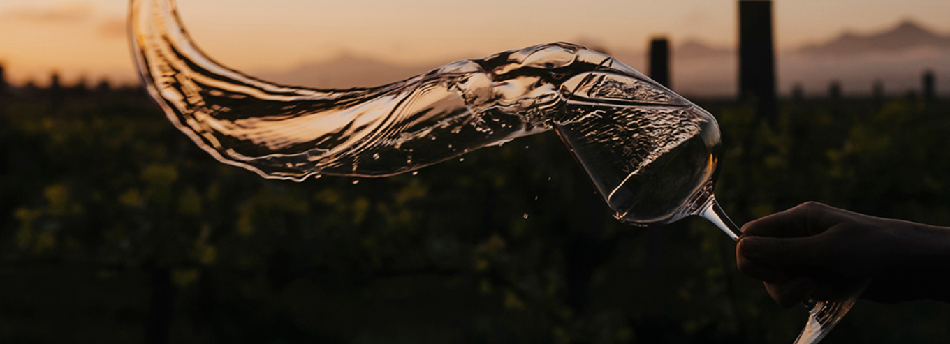 A wineglass with Spy Valley wine being swirled